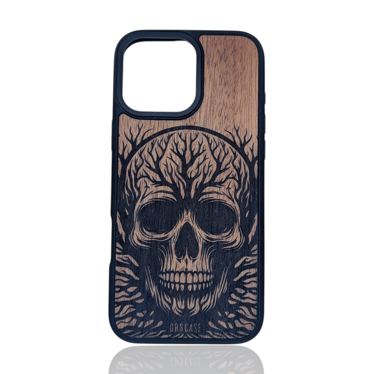 Intricate skull and tree branch design laser-engraved on a hand-finished premium wood phone case.