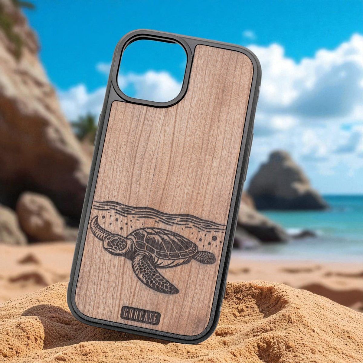Wooden phone case with turtle design on a beach