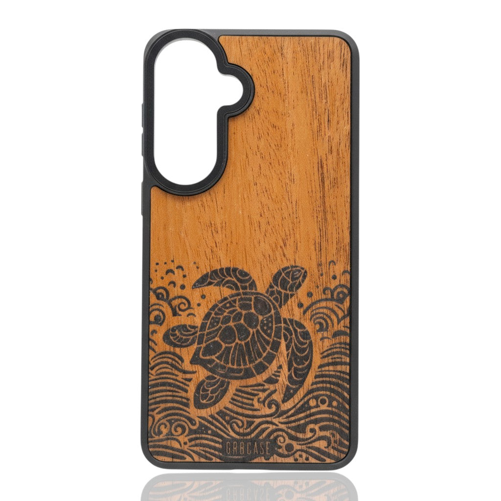Hand-finished wood phone case featuring a detailed sea turtle swimming through laser-etched ocean waves.
