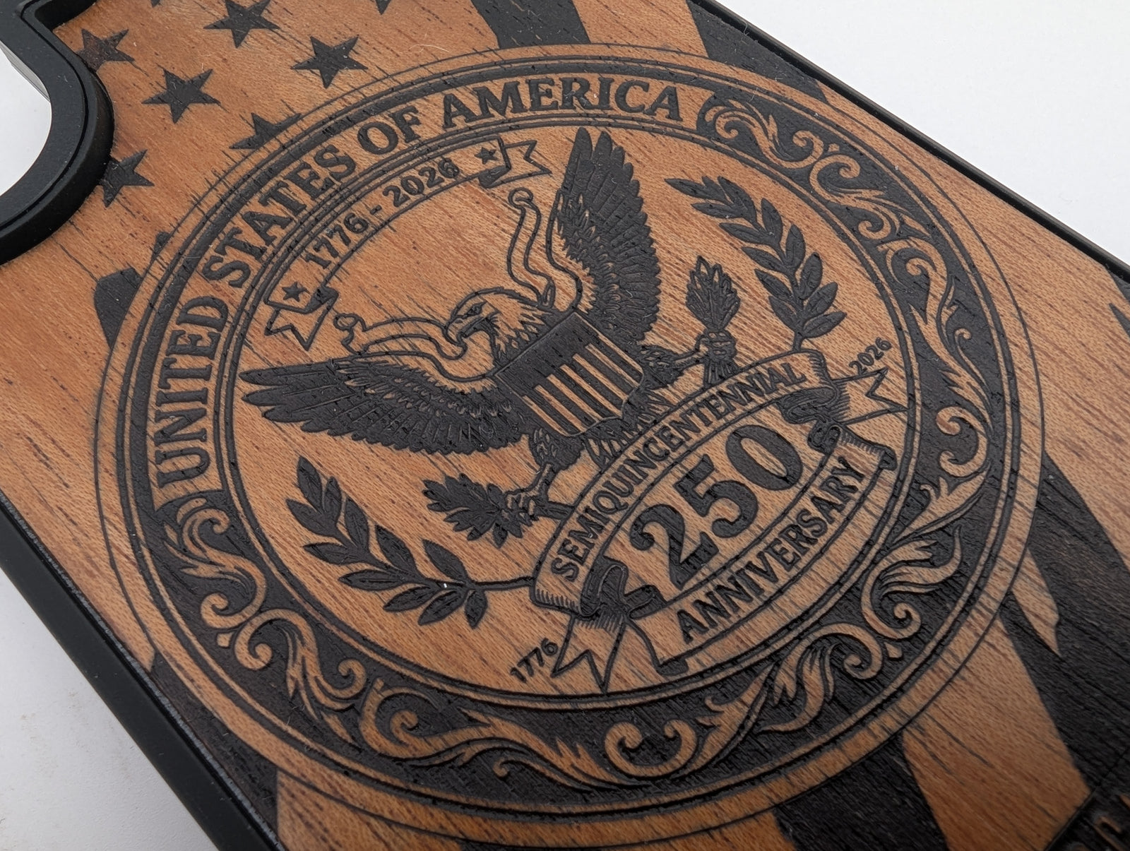 Hand-finished wood phone case featuring the United States 250th Anniversary Semiquincentennial seal with stars and stripes engraving.